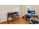 Well-lit office space with wood floors, desk setup and a window at 2427 Nottingham Greens Dr, Sun City Center, FL 33573