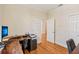 Spacious office area showcasing hardwood floors and ample workspace with closet at 2427 Nottingham Greens Dr, Sun City Center, FL 33573