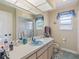 View of bathroom with single sink vanity and window at 2436 Nuremberg Blvd, Punta Gorda, FL 33983