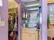 Bathroom view with single sink vanity and a closet with clothes at 2436 Nuremberg Blvd, Punta Gorda, FL 33983