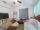 Bedroom with tv and ceiling fan at 2436 Nuremberg Blvd, Punta Gorda, FL 33983