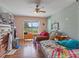 Bedroom with a ceiling fan and a large window overlooking the lake at 2436 Nuremberg Blvd, Punta Gorda, FL 33983