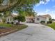 Well-kept home featuring mature trees, ample parking and partial water view at 2436 Nuremberg Blvd, Punta Gorda, FL 33983