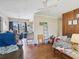 This living room leads to a kitchen, which offers a view of the backyard, and wood-style flooring at 2436 Nuremberg Blvd, Punta Gorda, FL 33983