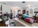 A combined living and dining space with wood-style floors and lots of items at 2436 Nuremberg Blvd, Punta Gorda, FL 33983