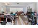 A combined living and dining area with tile flooring and filled with furniture and household items at 2436 Nuremberg Blvd, Punta Gorda, FL 33983