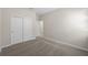 This carpeted bedroom is bright and spacious, with ample closet space at 2589 Winding Creek Trl, North Port, FL 34289