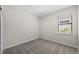 Cozy bedroom with a bright window with blinds allowing natural light at 2589 Winding Creek Trl, North Port, FL 34289