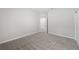 Spacious bedroom with neutral walls and carpeting, flooded with natural light at 2589 Winding Creek Trl, North Port, FL 34289