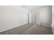 Neutral bedroom with carpet, white trim, and open doorway to hallway at 2589 Winding Creek Trl, North Port, FL 34289