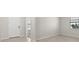 Bright entryway featuring a front door, adjacent window, and neutral tile flooring, opening to additional space at 2589 Winding Creek Trl, North Port, FL 34289