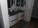 Modern bathroom featuring dual sinks, granite countertop and stylish cabinetry at 2617 Cove Cay Dr # 707, Clearwater, FL 33760