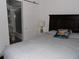 Bedroom with ensuite bathroom and a comfortable queen-sized bed at 2617 Cove Cay Dr # 707, Clearwater, FL 33760