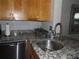 Kitchen featuring granite countertops, stainless steel appliances, and tile backsplash at 2617 Cove Cay Dr # 707, Clearwater, FL 33760