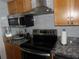 A kitchen showcasing stainless steel appliances and light wood cabinets at 2617 Cove Cay Dr # 707, Clearwater, FL 33760