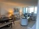Inviting living room with waterfront views, stylish furnishings, and an open layout at 2617 Cove Cay Dr # 707, Clearwater, FL 33760