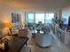 Bright living room with water views and comfortable seating arrangements at 2617 Cove Cay Dr # 707, Clearwater, FL 33760