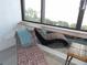 A sun room area with a chaise lounge and a water view at 2617 Cove Cay Dr # 707, Clearwater, FL 33760