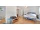 Bedroom featuring tile flooring, a bed, and a glimpse into an adjoining bathroom, providing ample space at 2807 Miriam S St, Gulfport, FL 33711