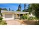 Charming single-story home with a brick driveway, well-maintained landscaping, and a welcoming front porch at 2807 Miriam S St, Gulfport, FL 33711