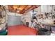 Spacious garage with red epoxy flooring, a workbench, and plenty of room for storage at 2807 Miriam S St, Gulfport, FL 33711