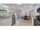 Bright and airy kitchen with modern appliances, white cabinetry, and a cozy dining area for casual meals at 2807 Miriam S St, Gulfport, FL 33711