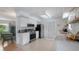 Well-lit kitchen featuring stainless steel appliances and granite countertops, with an open view to the living area at 2807 Miriam S St, Gulfport, FL 33711