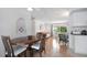 Open living space with dining area, daybed, and a view to the outdoors, featuring tile flooring throughout at 2807 Miriam S St, Gulfport, FL 33711