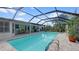 Screened-in pool with an adjacent patio area, ideal for outdoor entertaining and relaxation at 2807 Miriam S St, Gulfport, FL 33711