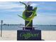 Gulfport, Florida sculpture of a lizard on a skateboard by the water at 2807 Miriam S St, Gulfport, FL 33711