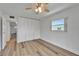 Bright bedroom features laminate flooring, a large closet and a window for natural light at 302 Andover Pl # G156, Sun City Center, FL 33573