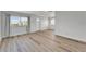 Bright living room with modern flooring and large windows offering plenty of natural light at 302 Andover Pl # G156, Sun City Center, FL 33573