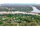 Stunning aerial view of the Hillsborough River winding through a vibrant neighborhood at 307 Fern Cliff Ave, Temple Terrace, FL 33617