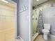 Bathroom featuring a shower, toilet, and doorway to a closet at 307 Fern Cliff Ave, Temple Terrace, FL 33617
