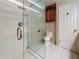 This well-appointed bathroom includes a shower, toilet, and built-in storage cabinet at 307 Fern Cliff Ave, Temple Terrace, FL 33617