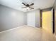 Bedroom featuring a fan, closet and neutral wall colors at 307 Fern Cliff Ave, Temple Terrace, FL 33617