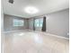 Well-lit bedroom featuring neutral walls, tile floors, and curtains at 307 Fern Cliff Ave, Temple Terrace, FL 33617