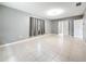 Bright bedroom with tile floors, neutral paint, and ample space at 307 Fern Cliff Ave, Temple Terrace, FL 33617