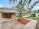Welcoming single-story home featuring a covered carport and landscaped front yard at 307 Fern Cliff Ave, Temple Terrace, FL 33617