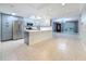 Open kitchen featuring new stainless steel appliances, center island, and modern finishes at 307 Fern Cliff Ave, Temple Terrace, FL 33617