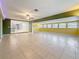 Large living room boasts tile flooring and views to the open kitchen at 307 Fern Cliff Ave, Temple Terrace, FL 33617