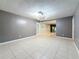 Open living room with tile flooring and neutral paint scheme is ideal for entertaining at 307 Fern Cliff Ave, Temple Terrace, FL 33617