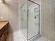 A stylish bathroom boasts a glass-enclosed shower with multiple shower heads at 307 Fern Cliff Ave, Temple Terrace, FL 33617