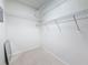 Spacious walk-in closet with shelves and tile flooring at 307 Fern Cliff Ave, Temple Terrace, FL 33617