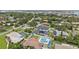 A luxurious backyard pool and patio offer prime outdoor living in a beautiful neighborhood setting at 316 Cedar Ln, Largo, FL 33770