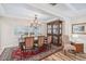 Formal dining room with hardwood floors, chandelier, and elegant furniture at 316 Cedar Ln, Largo, FL 33770