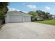 Exterior shot of a two-car garage attached to a charming single-story residence at 316 Cedar Ln, Largo, FL 33770