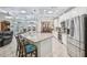 Bright kitchen with stainless steel appliances, a large island, and easy access to the pool area at 316 Cedar Ln, Largo, FL 33770