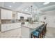 Spacious kitchen featuring a large island with seating and modern appliances at 316 Cedar Ln, Largo, FL 33770