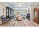 Cozy living room with a fireplace, hardwood floors, and elegant decor at 316 Cedar Ln, Largo, FL 33770